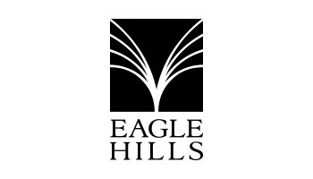 View of Ramhan Island by Eagle Hills developers with illuminated residences and a peaceful coastal atmosphere